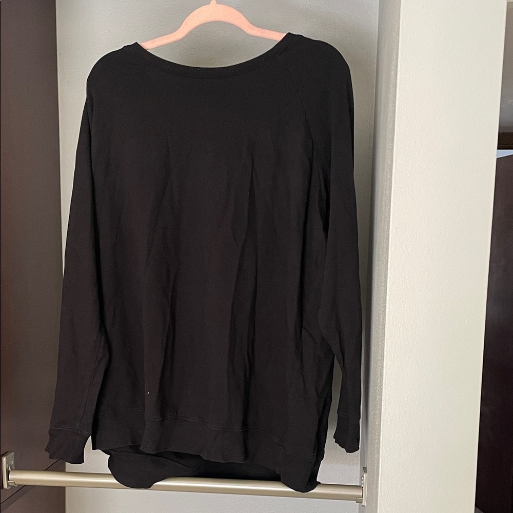 Black Long Sleeve crewneck. Material is slightly thicker than a long sleeve tee